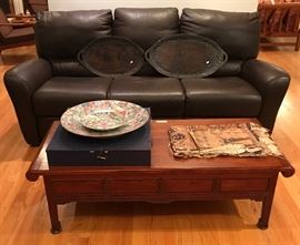 Natuzzi leather sofa.  Tapa cloth on table.