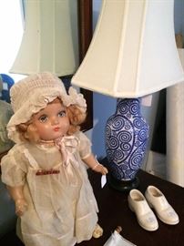 Antique doll; one of two matching blue & white lamps