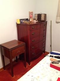 Dixie brand tall dresser next to a vintage sewing machine!