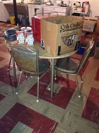 Neat compact dinette set! Vintage Cola cooler too!