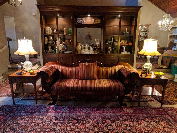 A beautiful example of a house, built in the early 70's, that has changed very little since. Here, you see part of their collection of beautiful Persian rugs, quality furniture, lamps, dust catchers, etc. The pair of end tables are from a high end furniture retailer in Ohio, the empire sofa is convertible - the back comes off and makes a daybed. 