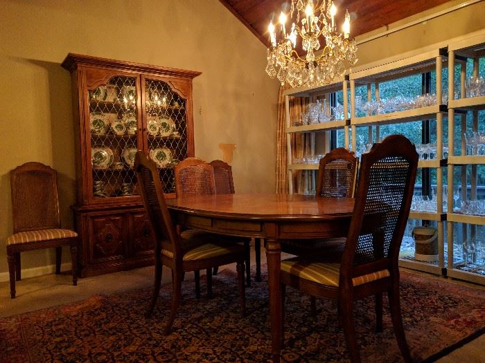 These people entertained a lot, have several sets of china and crystal stemware. This is their 1960's vintage Drexel Esperanto dining room set, consisting of a table with three leaves (with original pads) six side chairs, matching china cabinet and buffet.                                          The table is sitting on a Persian Bijar rug.                            The crystal chandelier is for sale, yes, thanks for asking!