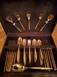 44-piece set of gold flatware, by International Silver Co., + mahogany chest.