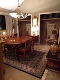 I told you they liked to entertain, so here you see their second dining room.                                                                         
This is where the "B" list sat, along with their weird uncle who lived in the basement. There is no basement in this house, so the uncle was REALLY weird.                                 The dining room table is vintage Henredon, the closeted chair is from the set of Pee-wee's Playhouse - Chairy! The framed fabric in each of the closets is from Norway.