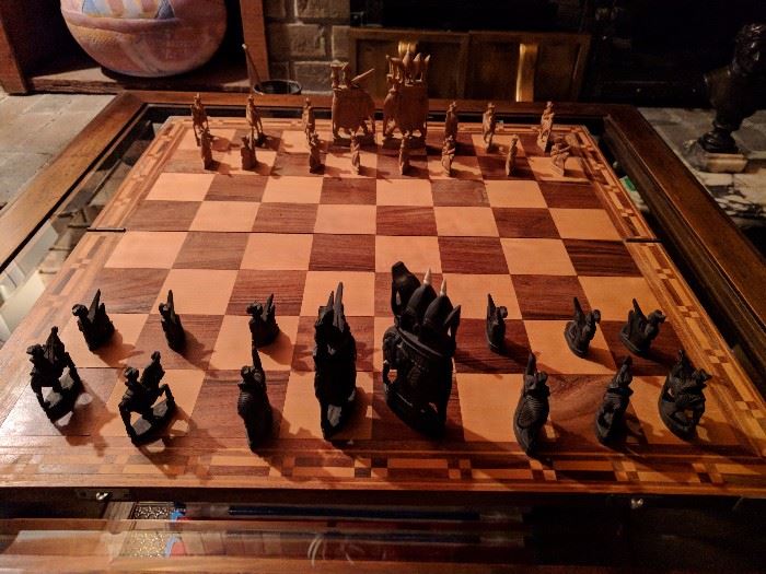 Very unique chess set - hand carved sandalwood pieces and well made board.