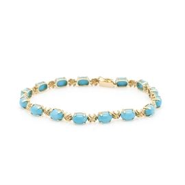 14K Yellow Gold 12.90 CTW Turquoise Bracelet: A 14K yellow gold 12.90 ctw turquoise bracelet. This bracelet features alternating oval Robin’s egg blue turquoise stones with beveled “X” links.