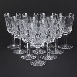 Waterford "Lismore" Crystal Goblets: A set of ten Waterford Lismore crystal goblets. Each goblet displays the Lismore pattern to the bowl with a cut vertical line and crosshatch motif. The pieces are etched “Waterford” to the base.
