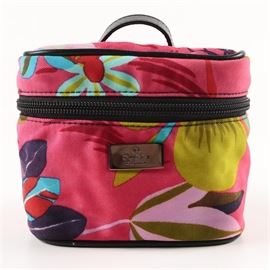 Gucci Floral Print Canvas Travel Bag: A Gucci floral print canvas travel bag. This hot pink canvas pouch has a vibrant floral pattern in reds, purples, blues and greens. It has a black leather top handle, zipper around the top portion with branded branded zipper pull, black leather trim along the edges and gun metal gray brand emblem to the front. The interior is lined in a black signature nylon with one slip pocket with snap closure to the top. A leather brand label attached to the lining is stamped “Gucci made in italy” to the front and with serial number “039-9950 1705” to the verso.