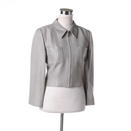 Chanel Boutique Jacket: A women’s Chanel grey viscose and linen blend huckaback woven jacket. This jacket features a pointed collar, a zip closure, two patch pockets, full length sleeves and silk lining. A cloth label is present to the interior and is marked “Made in France”.