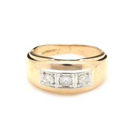 14K Yellow Gold Diamond Ring: A 14K yellow gold diamond ring. This ring features three round brilliant cut diamonds laid in square borders on a wide tapered band.