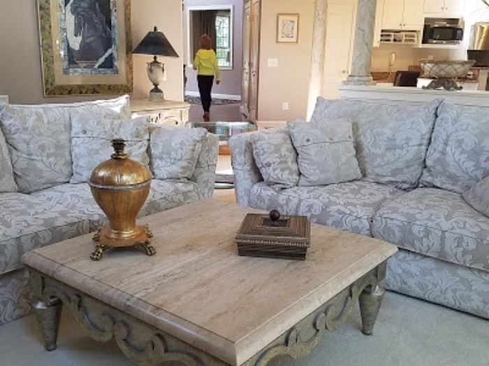 Sofas, stone coffee table by Swaim furniture and decor.