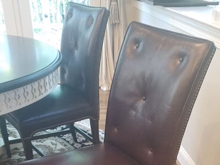 Nailhead leather chairs by Henredon.