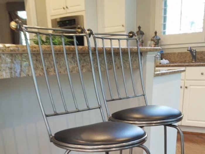 Pair of bar height counter stools in pewter finish by Charleston Forge.