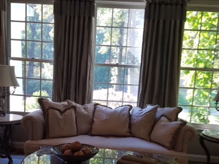 Embassy sofa, silk, Pallazzo silver brush fringe on pillows, some sun damage to the back facing the window.