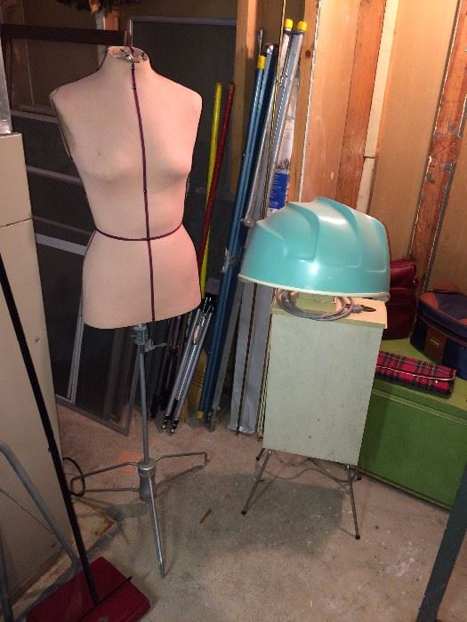 Dressmaker form and standing hair dryer.