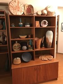 Teak bookcase filled with many wonderful original works of art!