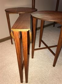 Teak small collapsible stools. (Three are pictured, however; there are a set of four)