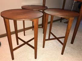 Teak small collapsible stools. (Three are pictured, however; there are a set of four)