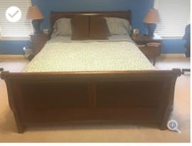Bedroom set. Queen size bed with two end tables, dresser and mirror.