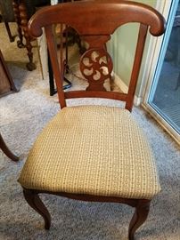 1 of 4 chairs to the dining table and chairs