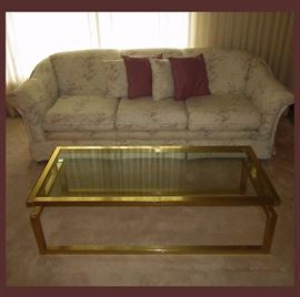 Clean and Comfy Sofa and Mid Century Modern Glass and Metal Coffee Table 