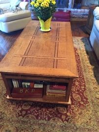 Coffee Table with storage on side and underneath top - raises to table height 