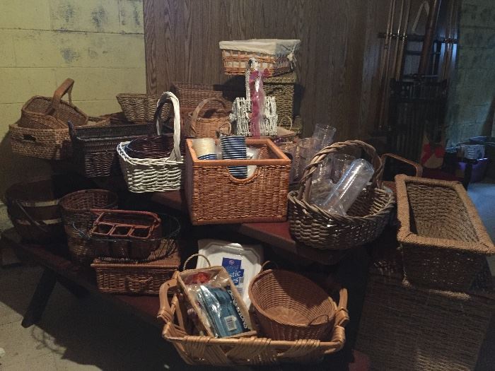 Extensive collection of baskets on top of a folding 8ft picnic table with bench seats