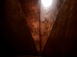 Closeup of entertainment cabinet diamond inlay pattern