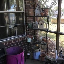 Bakers rack with Items on screen porch