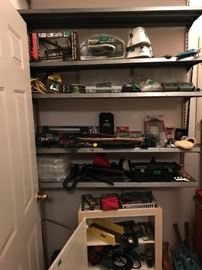 Room off garage: small cabinet, lots of miscellaneous