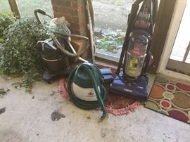 Screen porch - live plants in concrete planters, Bissell Little Green cleaner, and Bissell pet scrubber 