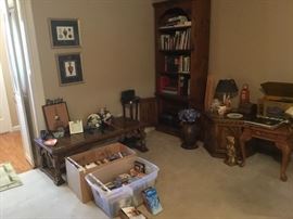 Bookcase with books, plant stand, end tables, VHS tapes, DVD’s