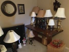 Large screen tv, fold down table, round mirror, lamps