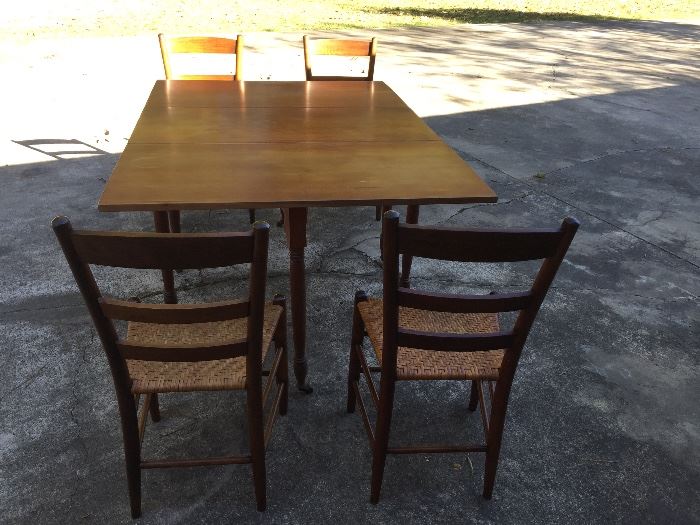 Vintage solid cherry gate leg table. 4 rush bottom chairs can be purchased in addition