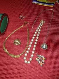Sterling Silver, Pearls, and other metals. 