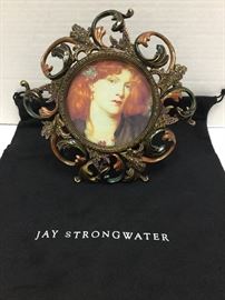 THIS IS A BEAUTIFUL frame by Jay Strongwater. 
Made of cast metal. Hand enameled and hand set with Swarovski® crystals.
8"W x 10; holds a 4" x 6" photo.
Comes with original box Strongwater, price tag and dust bag