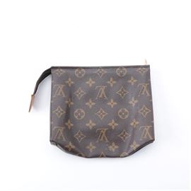 Louis Vuitton Monogram Zipper Pouch: A Louis Vuitton monogram zipper pouch. This brown pouch features a brown coated canvas body with the Louis Vuitton “LV” and fleur de lis designs. It has a top zipper closure with a tan leather accent and a tan interior. The pouch is stamped “Made in France”.