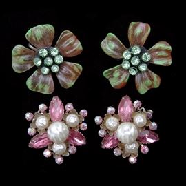 Vintage Costume Jewelry Earrings: Two pairs of vintage costume jewelry clip on earrings. The cluster earrings feature faux pearls and pink rhinestones. The flower earrings feature green and red/brown brush stroke petals and green rhinestone center accents. The earrings are not marked.
