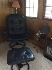 black leather chair and foot stool