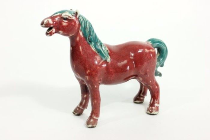 Lot 531: Kangxi Oxblood Red Porcelain Horse