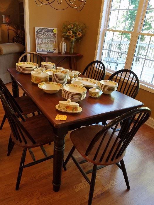 Solid wood butcher block style kitchen table with 6 chairs.