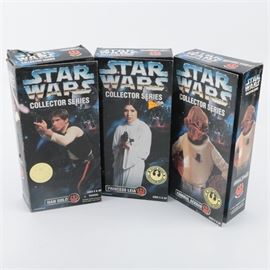 "Star Wars" Collector Series Action Figures: A selection of Star Wars Collector Series action figures. This selection features three Star Wars Collector Series poseable action figures presented in their original packaging. The action figures were produced in 1996 by Kenner and depict Han Solo, Princess Leia, and Admiral Ackbar.