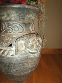 Large ceramic decorative urn with silk floral arrangement.  Urn measures 23" tall.