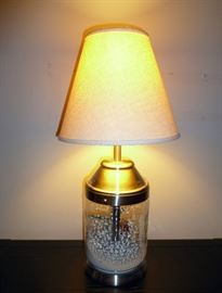 Table lamp.  Base opens to put whatever decorative items you want to display inside.