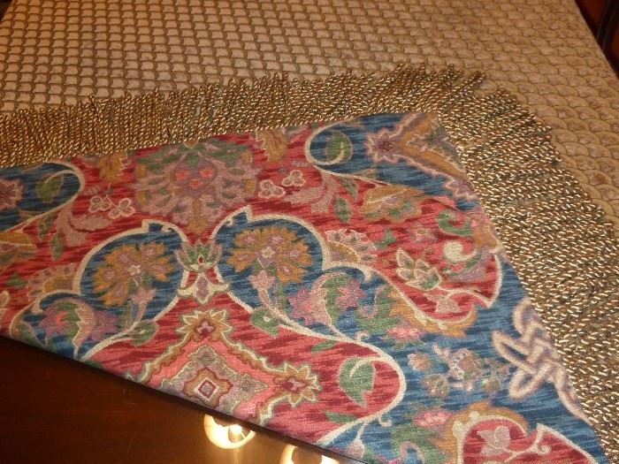 Large, heavyweight, table cover.  Reversible:  Soft shell pattern to gorgeous jewel tone  pattern.  65" square (including twisted fringe).