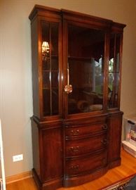 Vintage mahogany china cabinet by Landstrom Furniture.  Glass door (with key), wood shelves with plate grooves, 3 large drawers, 2 side doors with storage areas.  47" wide, 18" deep, 75" tall