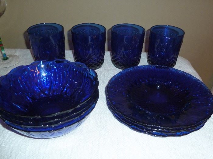 Cobalt blue glass dinnerware.  Glasses, bowls, salad plates and dinner plates (service for four).