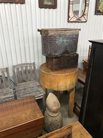 Round butcher block table, architectural carving, copper boiler, old wooden crates & boxes 