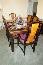 Dining table has 8 chairs and 2 leaves, made by Badcock.  Has matching bar and sideboard