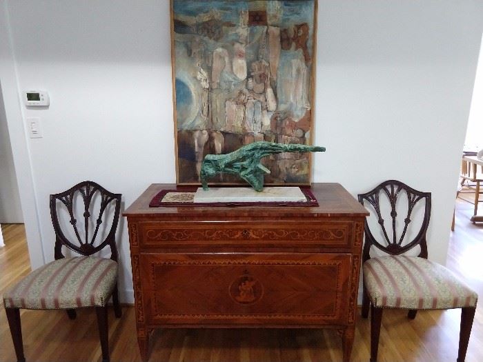 BEAUTIFUL  inlaid French commode, with copper figure on white marble base, overlorded by an original oil on canvas, flanked b y a pair of mahogany side chairs.